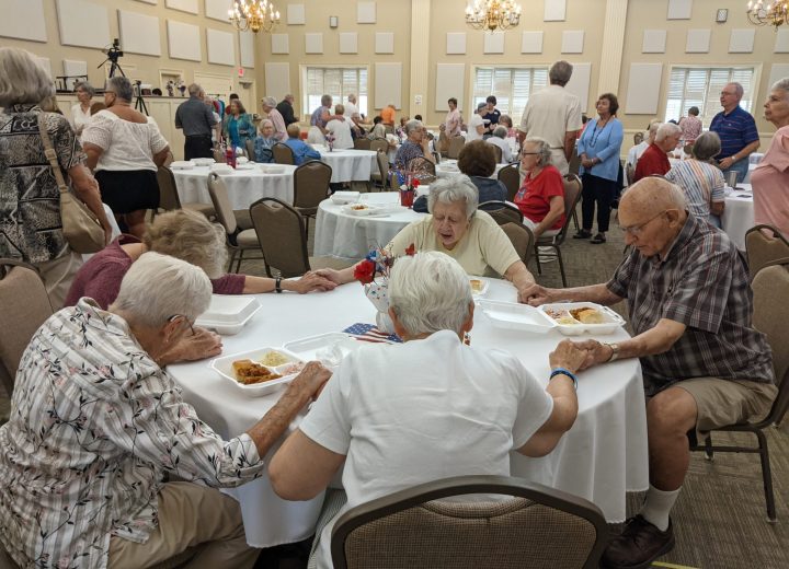 PT praying around table